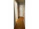 Hallway with hardwood flooring and white doors at 15159 Sw 43Rd Terrace Rd, Ocala, FL 34473