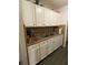 This functional kitchen boasts light cabinets, plenty of counter space, and modern flooring at 15159 Sw 43Rd Terrace Rd, Ocala, FL 34473