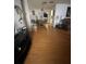 Inviting open-concept living room featuring hardwood floors that flow into dining area at 15159 Sw 43Rd Terrace Rd, Ocala, FL 34473