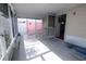 This airy screened in porch has space for sitting and enjoying the weather and views at 15159 Sw 43Rd Terrace Rd, Ocala, FL 34473
