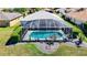 Aerial view of property with screened pool, landscaped yard, and charming curb appeal in a residential neighborhood at 1738 Sw 157Th Place Rd, Ocala, FL 34473