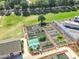 Aerial view of a community garden with a variety of raised beds and landscaping near RV parking at 1738 Sw 157Th Place Rd, Ocala, FL 34473