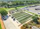 Aerial view of bocce ball courts, a community garden, and RV parking within a well-maintained retirement community at 1738 Sw 157Th Place Rd, Ocala, FL 34473