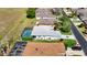 A high-angle view of a single-Gathering home featuring a private, screened-in pool in a residential neighborhood at 1738 Sw 157Th Place Rd, Ocala, FL 34473