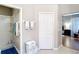 Bright bathroom features a glass-enclosed shower and a convenient towel rack for easy access at 1738 Sw 157Th Place Rd, Ocala, FL 34473