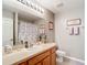 Well-lit bathroom featuring a shower-tub combo and a single sink vanity with ample counter space at 1738 Sw 157Th Place Rd, Ocala, FL 34473