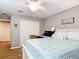 Serene bedroom with a ceiling fan, closet, and comfortable queen-size bed at 1738 Sw 157Th Place Rd, Ocala, FL 34473
