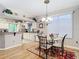 Dining room area adjacent to kitchen, featuring modern lighting and neutral tones at 1738 Sw 157Th Place Rd, Ocala, FL 34473
