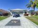 Charming single-story home with a well-maintained lawn, landscaping, and a convenient golf cart at 1738 Sw 157Th Place Rd, Ocala, FL 34473