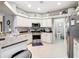 Well-lit kitchen featuring stainless steel appliances, modern counters, and ample storage at 1738 Sw 157Th Place Rd, Ocala, FL 34473
