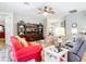 Spacious living room with comfortable furnishings and views into other living areas at 1738 Sw 157Th Place Rd, Ocala, FL 34473