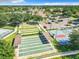 Aerial view of community shuffleboard courts, tennis courts, basketball court, and parking at 1738 Sw 157Th Place Rd, Ocala, FL 34473