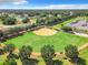Aerial shot of a softball field in a residential community, surrounded by trees and houses at 1738 Sw 157Th Place Rd, Ocala, FL 34473