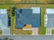 Bird's eye view of a home with solar panels and a well-manicured lawn at 17594 Se 95Th Cir, Summerfield, FL 34491