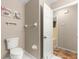 Bathroom with toilet and view of patterned floors. Neutral walls and good lighting at 17594 Se 95Th Cir, Summerfield, FL 34491