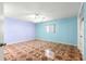 Bright and airy bedroom featuring unique flooring, a ceiling fan, and a window at 17594 Se 95Th Cir, Summerfield, FL 34491