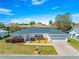 Charming home exterior with a well-manicured lawn and a paved driveway at 17594 Se 95Th Cir, Summerfield, FL 34491