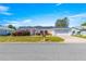 Charming single-story home with a manicured lawn, brick accents, and an attached two-car garage at 17594 Se 95Th Cir, Summerfield, FL 34491