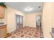 Kitchen area with access to the enclosed patio and the laundry room at 17594 Se 95Th Cir, Summerfield, FL 34491