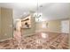 Open-concept living area with patterned flooring and neutral walls at 17594 Se 95Th Cir, Summerfield, FL 34491