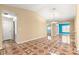 Spacious living room featuring patterned floors, recessed lighting, and access to different rooms at 17594 Se 95Th Cir, Summerfield, FL 34491