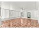Bright sun room with tile flooring, multiple windows, and a ceiling fan at 17594 Se 95Th Cir, Summerfield, FL 34491