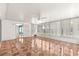 Enclosed sunroom with tiled floor, white walls, and large windows at 17594 Se 95Th Cir, Summerfield, FL 34491