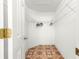 Bright walk-in closet features wire shelving and unique patterned flooring at 17594 Se 95Th Cir, Summerfield, FL 34491