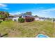 A well-maintained yard surrounds a charming single-story home with a two-car garage and attractive landscaping at 17594 Se 95Th Cir, Summerfield, FL 34491