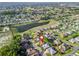 Panoramic aerial view highlights the property's prime location near a pond, nestled within a peaceful community at 17898 Se 125Th Cir, Summerfield, FL 34491