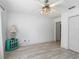 Bedroom featuring white walls, light wood floors, ceiling fan, and natural light at 17898 Se 125Th Cir, Summerfield, FL 34491