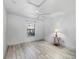 Bedroom featuring white walls, light wood floors, a ceiling fan and plenty of natural light at 17898 Se 125Th Cir, Summerfield, FL 34491