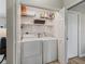 Laundry room with washer, dryer, and shelving for storage at 17898 Se 125Th Cir, Summerfield, FL 34491