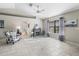 Bright living room featuring a fireplace, tile floors, and backyard view at 17898 Se 125Th Cir, Summerfield, FL 34491