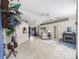 Bright living room featuring high ceilings, a fireplace, and tile floors at 17898 Se 125Th Cir, Summerfield, FL 34491