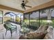 Relaxing screened-in patio with seating and outdoor views at 17898 Se 125Th Cir, Summerfield, FL 34491