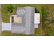 Aerial view of the house, featuring a roof, and a patio at 17965 Se 107Th Ct, Summerfield, FL 34491