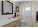 Bathroom with vanity, large mirror, and shower with modern curtain and fixtures at 17965 Se 107Th Ct, Summerfield, FL 34491
