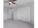 A bedroom with four closets and neutral flooring providing ample storage space at 17965 Se 107Th Ct, Summerfield, FL 34491