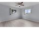 A well-lit bedroom with two windows and stylish flooring at 17965 Se 107Th Ct, Summerfield, FL 34491
