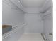 A walk-in closet with lots of shelves and storage for an organized wardrobe at 17965 Se 107Th Ct, Summerfield, FL 34491