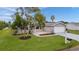 Well-kept home featuring a manicured lawn and a charming covered front porch at 17965 Se 107Th Ct, Summerfield, FL 34491