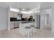 Well-appointed kitchen with modern appliances, a stylish kitchen island, and sleek black subway tile backsplash at 17965 Se 107Th Ct, Summerfield, FL 34491