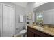 Bathroom featuring a granite countertop, neutral walls, and ample storage in the white cabinets at 1852 Rafton Rd, Apopka, FL 32703