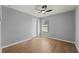 Empty bedroom with a window, fan, and laminate flooring at 1852 Rafton Rd, Apopka, FL 32703