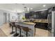 Stylish kitchen with bar stool seating, stainless appliances, and easy access to the dining area at 1852 Rafton Rd, Apopka, FL 32703