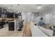 Open concept kitchen with a breakfast bar overlooking the living room, perfect for casual dining at 1852 Rafton Rd, Apopka, FL 32703