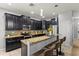 Kitchen with granite countertops, stainless steel appliances, and a breakfast bar for convenient seating at 1852 Rafton Rd, Apopka, FL 32703