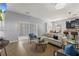 Spacious living room connected to the kitchen and dining area, ideal for gatherings and entertaining at 1852 Rafton Rd, Apopka, FL 32703