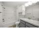 Bright bathroom featuring a shower and tub combo, grey vanity and cabinetry, plus a stylish grey countertop at 1853 Pasqua Pl, The Villages, FL 32163